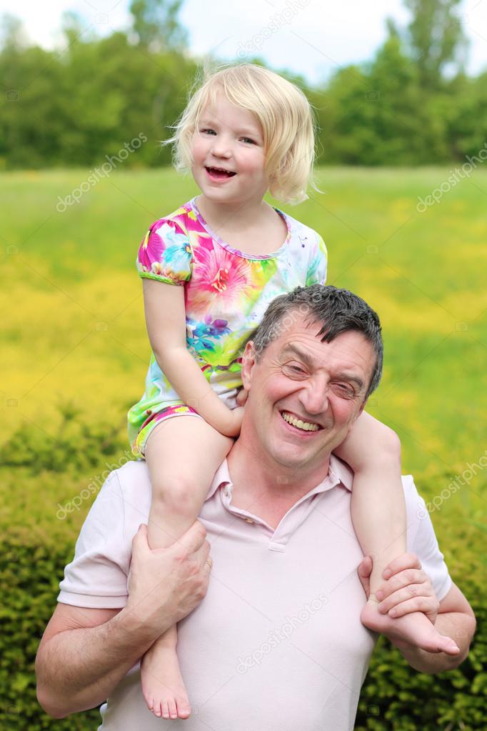 Father and daughter playing together outdoors