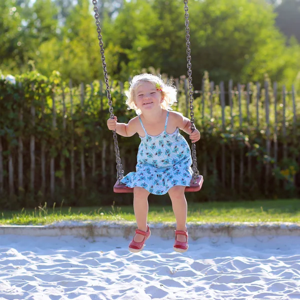 Little girl  swinging — Stock Photo, Image