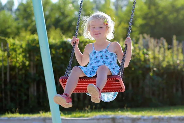 Little girl  swinging — Stock Photo, Image