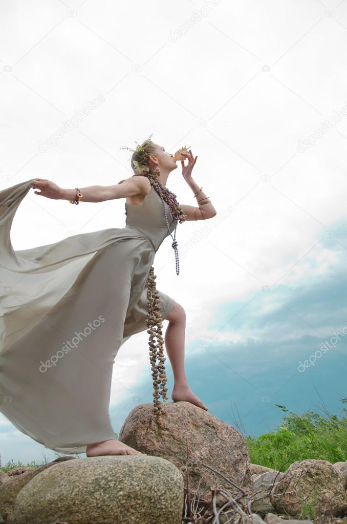 girl blowing into sink