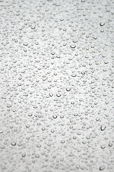 Regentropfen auf Glas - Hintergrund — Stockfoto