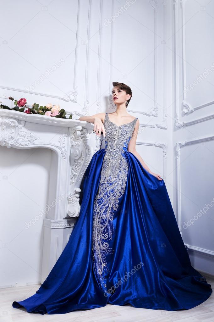 In a blue dress
