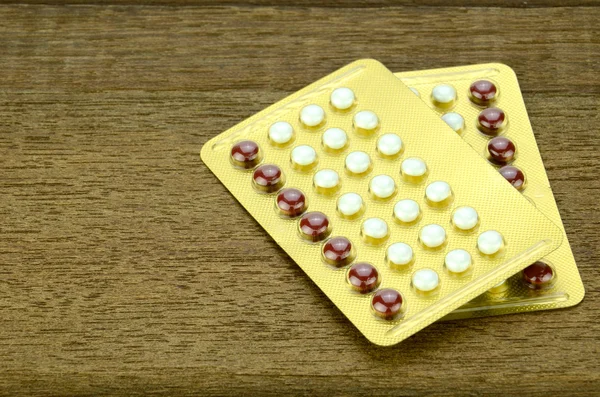 Hormonální antikoncepce na pozadí. — Stock fotografie
