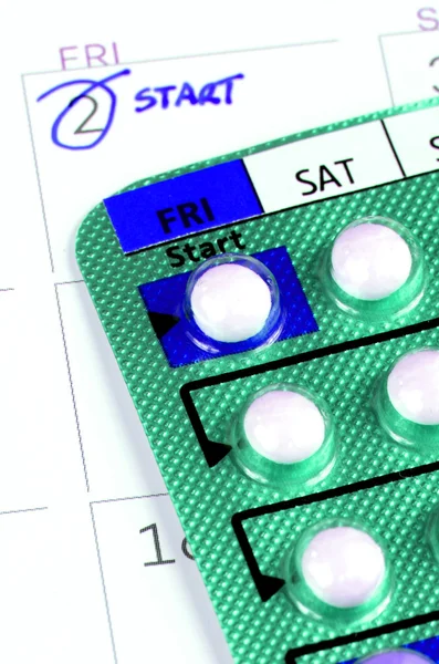 Strip of Contraceptive Pill on the Calendar with Start Taking Date Remark — Stock Photo, Image