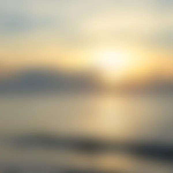 早朝の光がぼやけて日の出背景、自然光の現象. — ストック写真