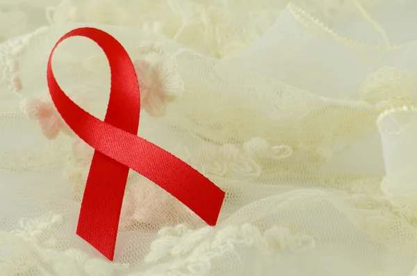 World Aids Day Red Ribbon Sign on Soft Creamy Background. Sign for AIDS - HIV Campaign. — Stock Photo, Image