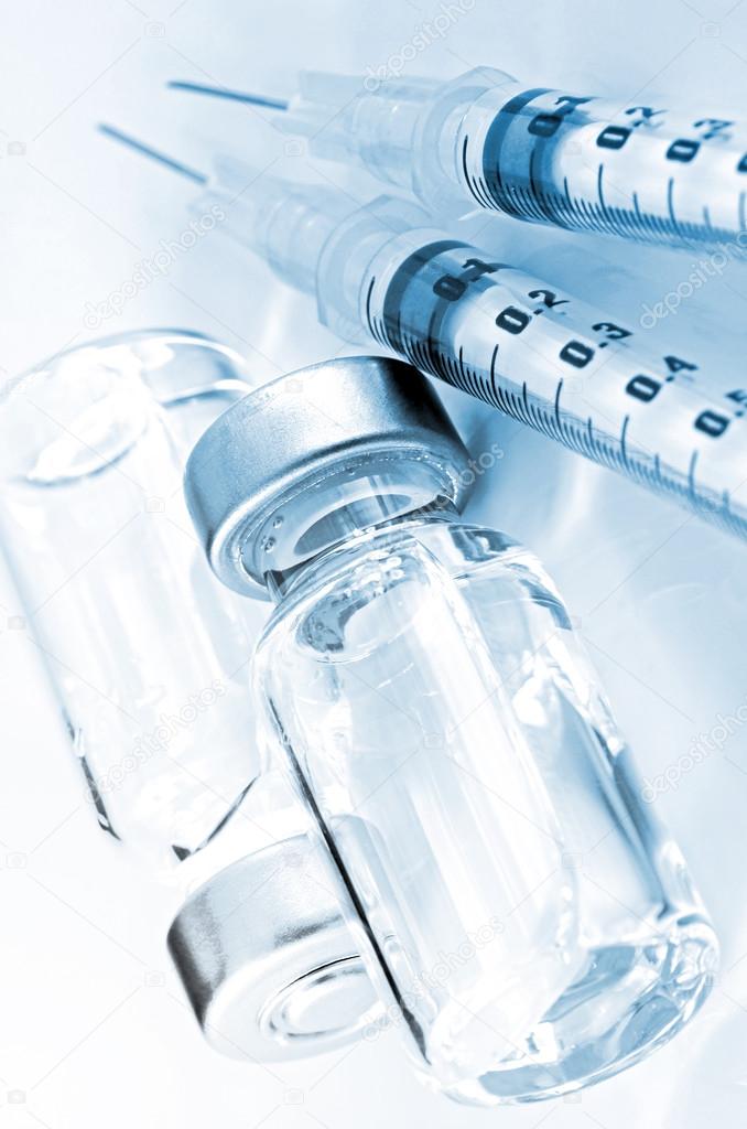 Tuberculin Syringe and Sterile Vial Filled with Medication Solution. An