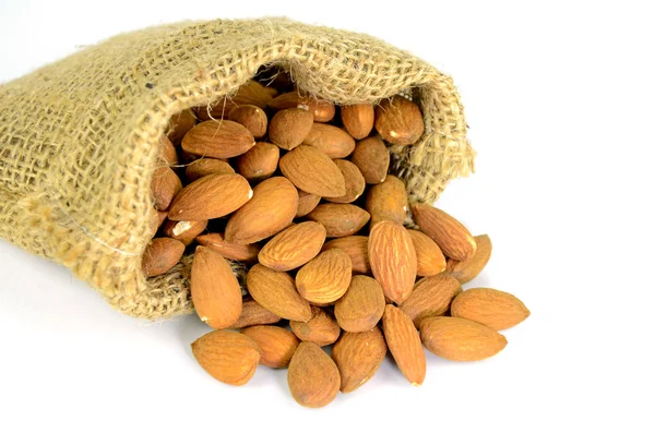 Baked Almond Nut in Berlap Sac Isolated on White Background. — Stock Photo, Image