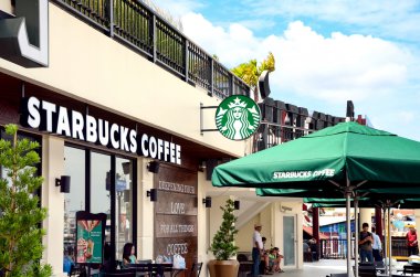 A new branch of Starbucks coffee available in Bangkok, Thailand. clipart