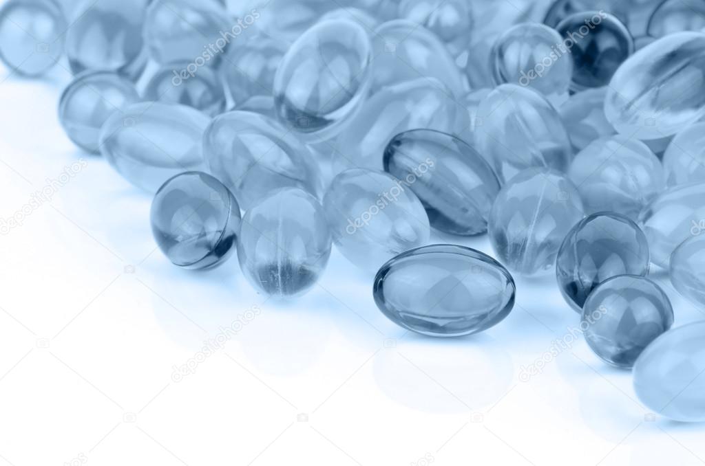 Soft gelatin capsule medicine on white background.