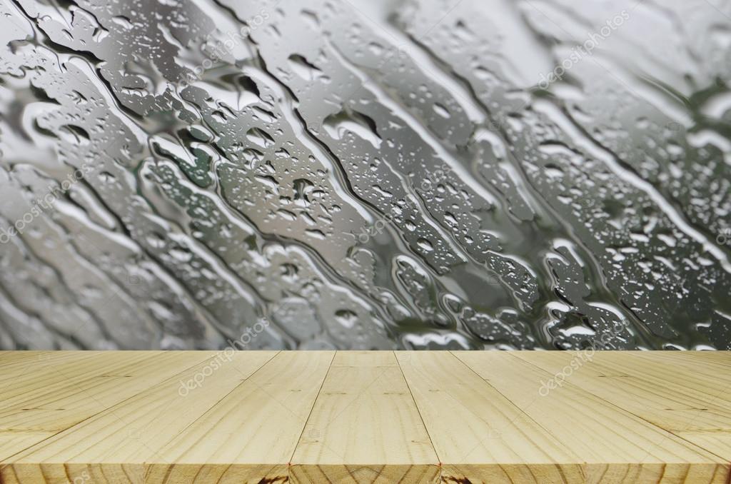 Rain Drops On Glass Window Background With Wood Table Stock Photo Image By C Areeya Rain Drops On Glass Window Background With Wood Table Stock Photo Image By C Areeya