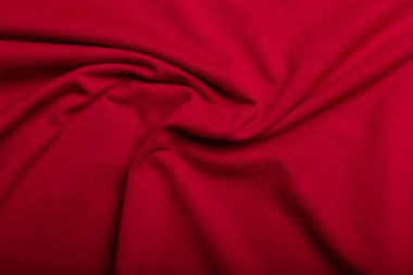 Kırmızı pamuk kırışık kumaş dokusu, arka plan ya da fon. Kıyafet, dikiş, kongre yapımı, tuhafiye. Boşluğu kopyala.