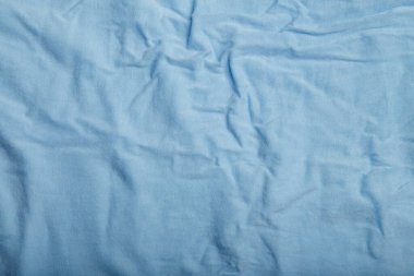 Mavi pamuk kırışık kumaş dokusu, arka plan ya da fon. Kıyafet, dikiş, kongre yapımı, tuhafiye. Boşluğu kopyala.