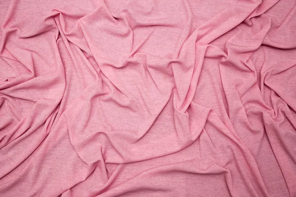 background of pink fabric, wavy texture, wrinkled