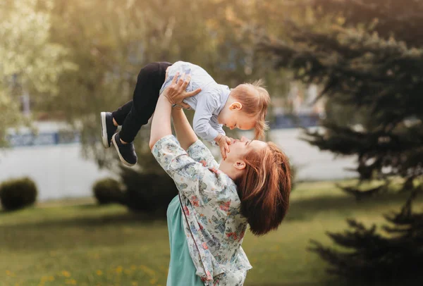 Cute Mother Lifting Her Two Year Old Toddler Her Head — Stock Photo, Image