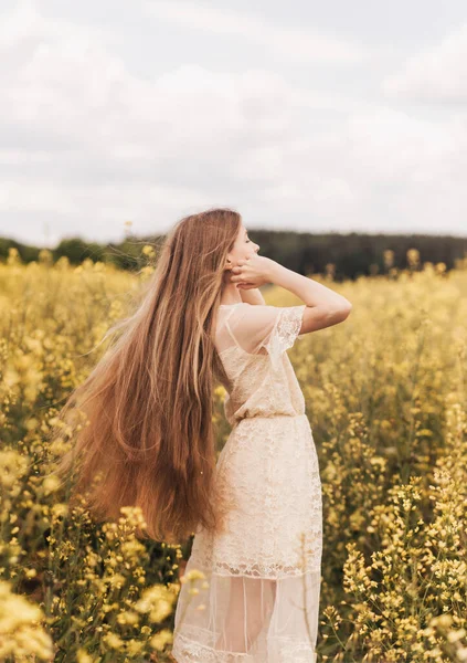 Young Beautiful Girl Long Hair Walks Rapeseed Field Looks Distance — Stock Photo, Image