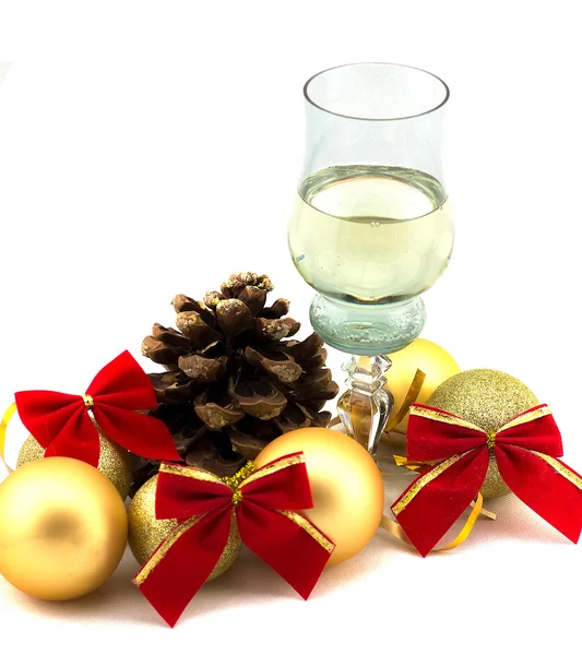 Glass of champagne with Christmas decorations on a white background — Stock Photo, Image