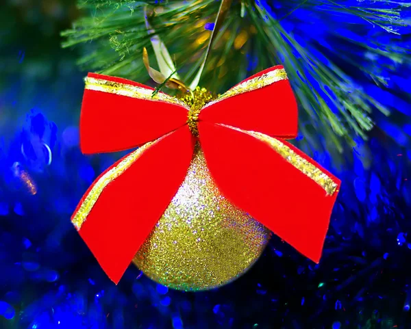 Christmas ball with red ribbon — Stock Photo, Image
