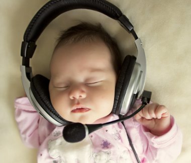 Baby with headphones clipart