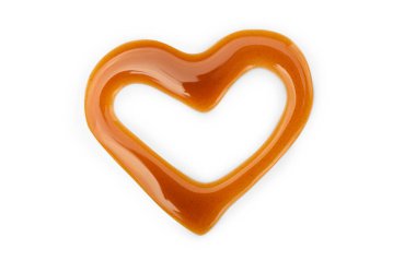 Sweet caramel topping in shape of heart isolated on white background. Top view. clipart