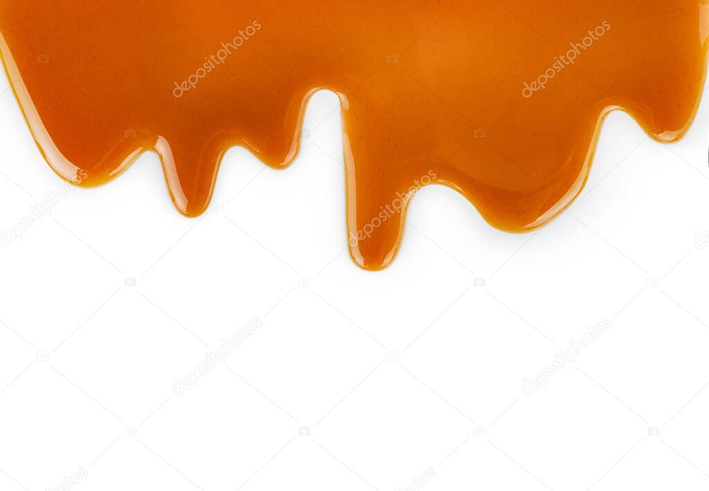 Sweet caramel topping isolated on white background. Top view. Copy space.