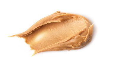 Beyaz arka planda izole edilmiş kremalı fıstık ezmesi. Üst görünüm.