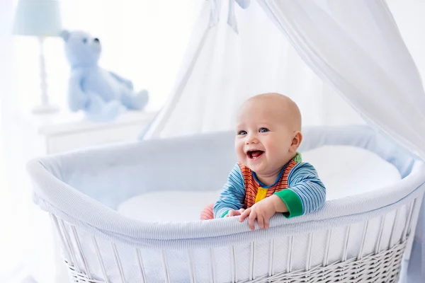 Cute baby in white nursery — Stok fotoğraf