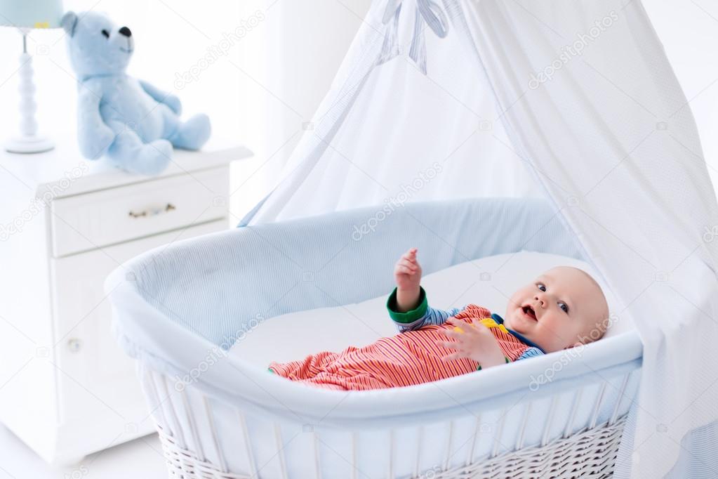 Cute baby in white nursery