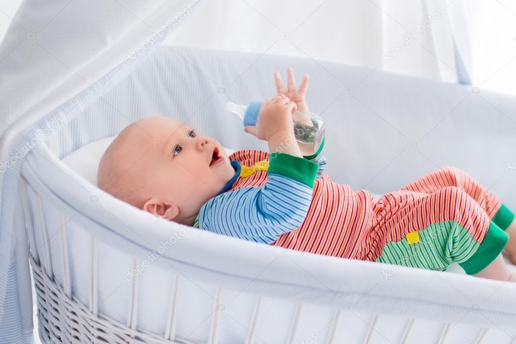 Little Baby With Bottle In White Bed Stock Photo C Famveldman