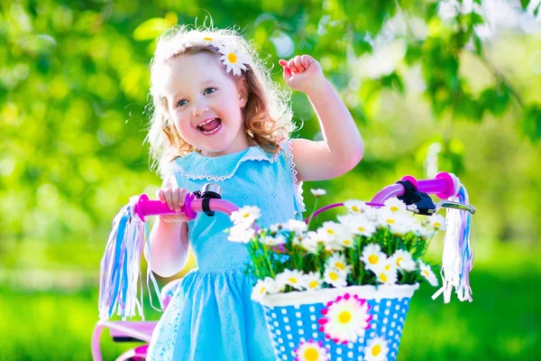 Little girl riding a bike — Stock Photo, Image