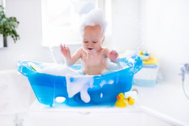Little baby taking a bath