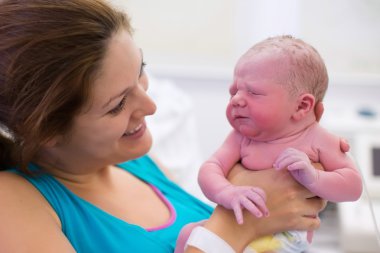 Young mother giving birth to a baby