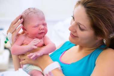 Young mother giving birth to a baby