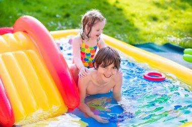 Kids playing in inflatable pool clipart
