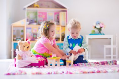 Kids playing with stuffed animals and doll house clipart