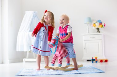 Kids playing with rocking horse