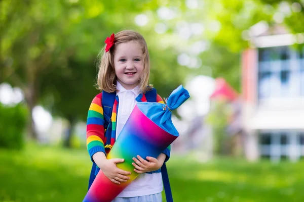 Little child with candy cone on first school day — Stock Photo, Image