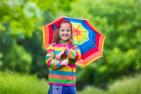 Child playing in the rain — Stock Photo, Image