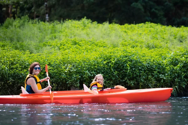 Mother and child in a kayak