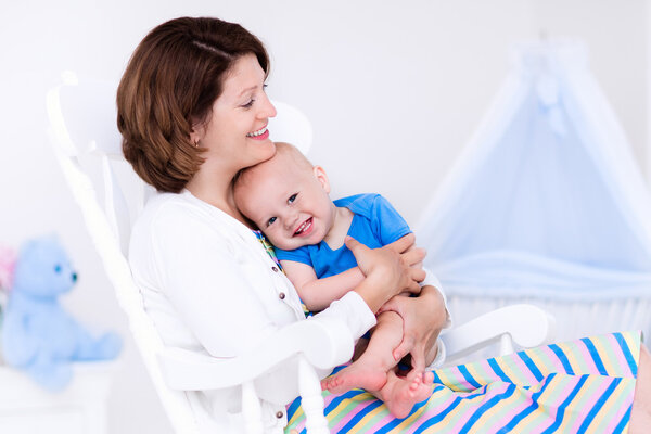 Mother and baby in white bedroom