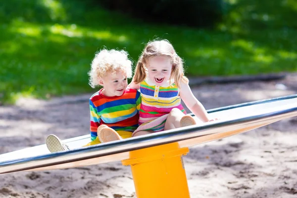 Kids having fun on a playground Stock Picture