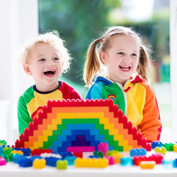 Kids playing with colorful blocks — Stock Photo, Image