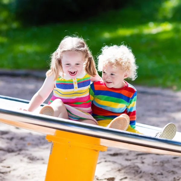 Kids having fun on a playground Stock Photo