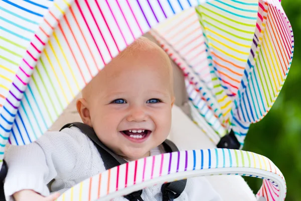 Baby in white stroller — Stock Photo, Image