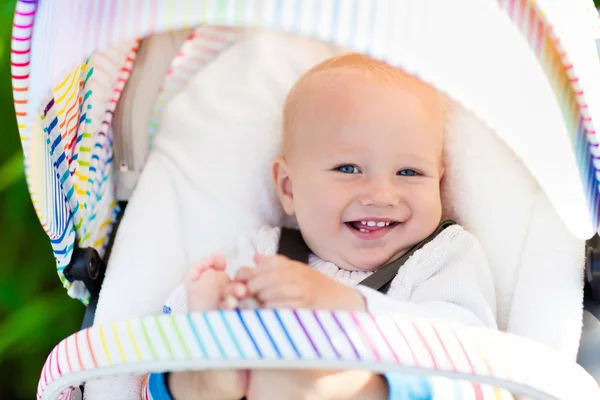 Baby in white stroller — Stock Photo, Image