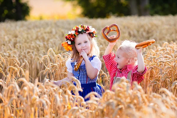 Kids in Bavarian costumes in wheat field — Stock Photo, Image