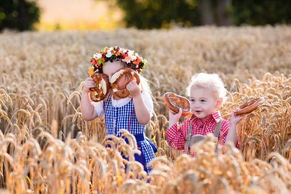 Kids in Bavarian costumes in wheat field — Stock Photo, Image