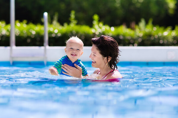 Mother and baby in swimming pool