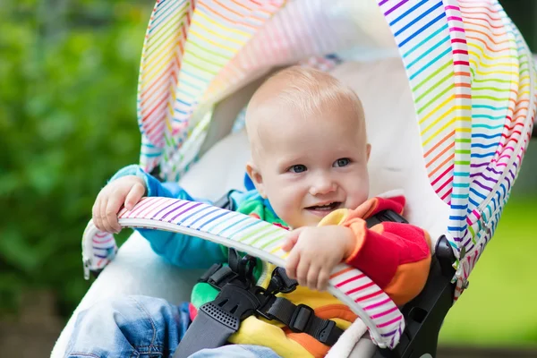 Baby boy in white stroller — Stock Photo, Image