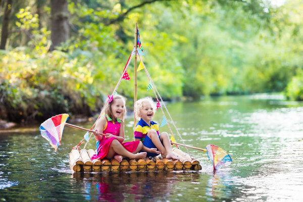 Kids on wooden raft